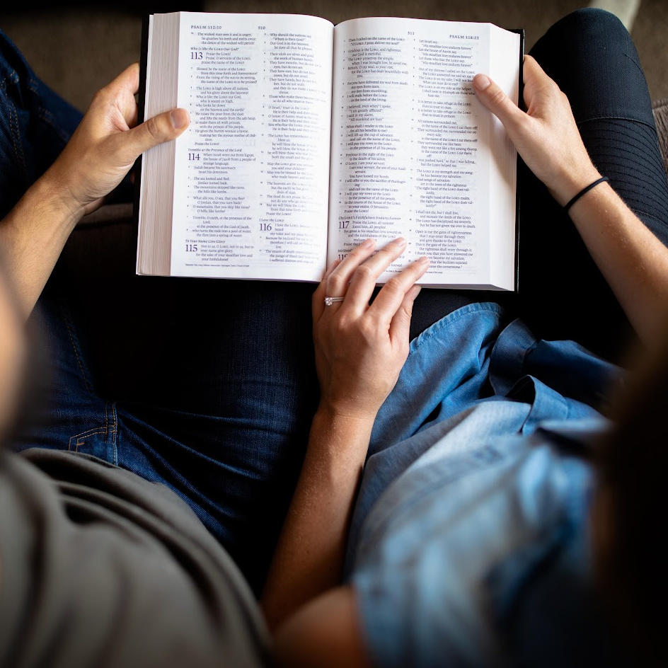 Couple with a Bible on Their Laps | Family Gospel Learning Strengthens Families | The Power of Home-Based Scripture Studies