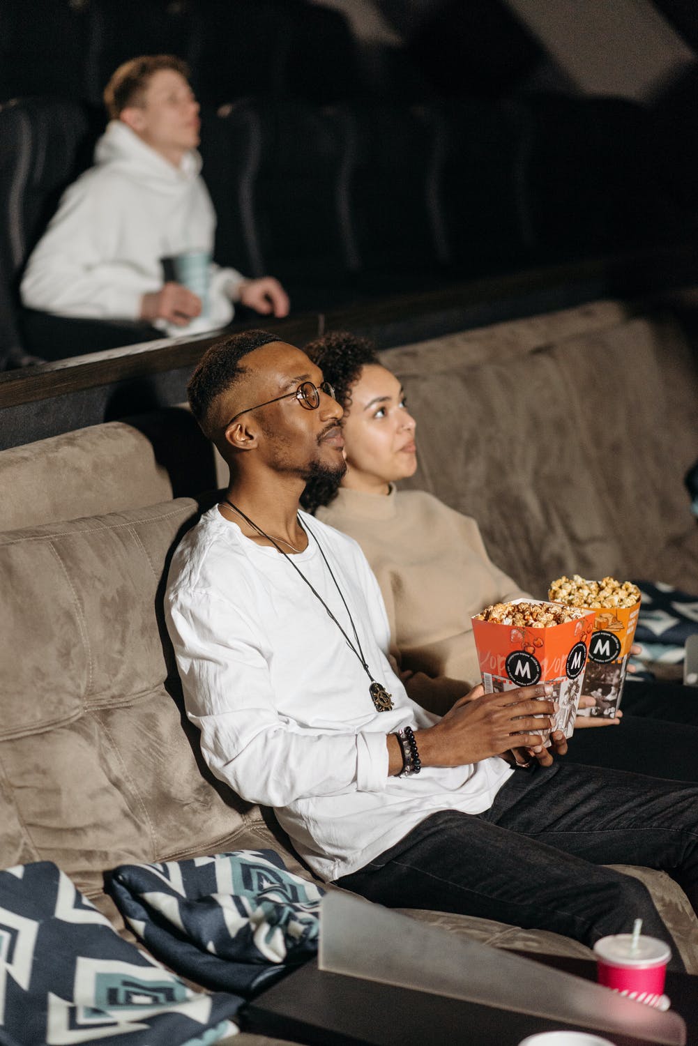 Couple with Popcorn Watching a Movie Together | Are Mature Adult Movies Really Just Crass? | Public Square Magazine | What Does For Mature Audiences Only Really Mean?