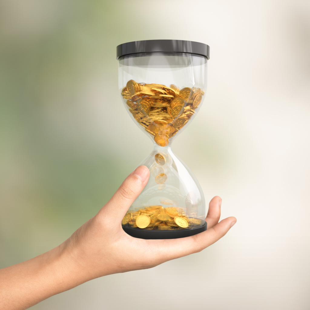 Hourglass with coins, symbolic of the slipping economic conditions leading to poverty increase.